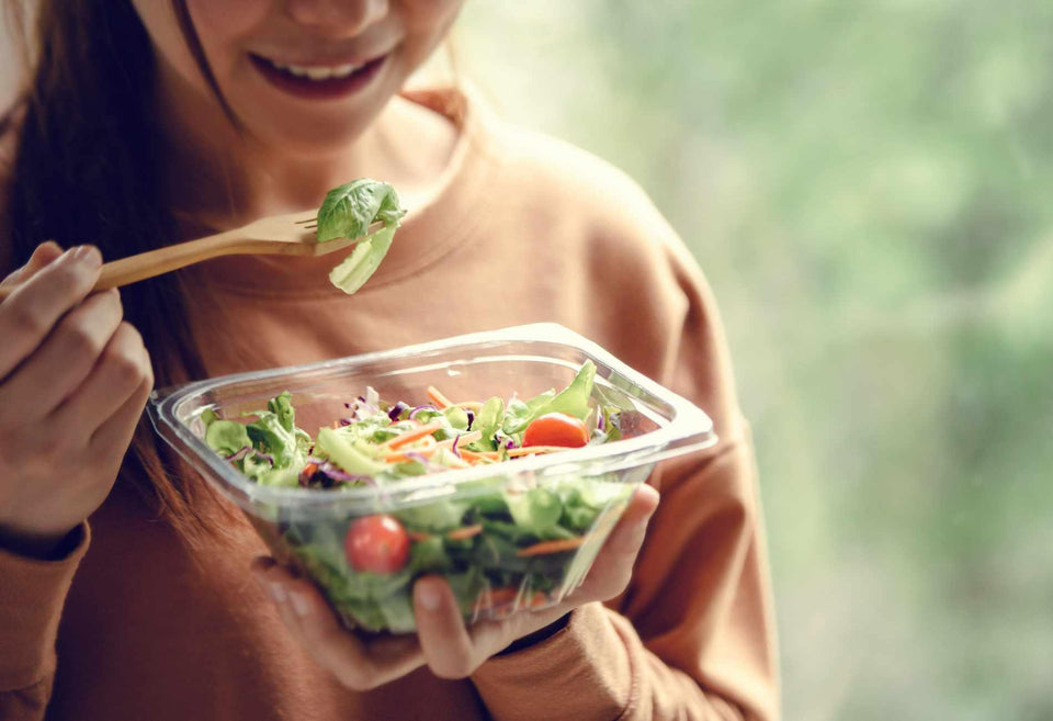 Person eating a salad for gut health